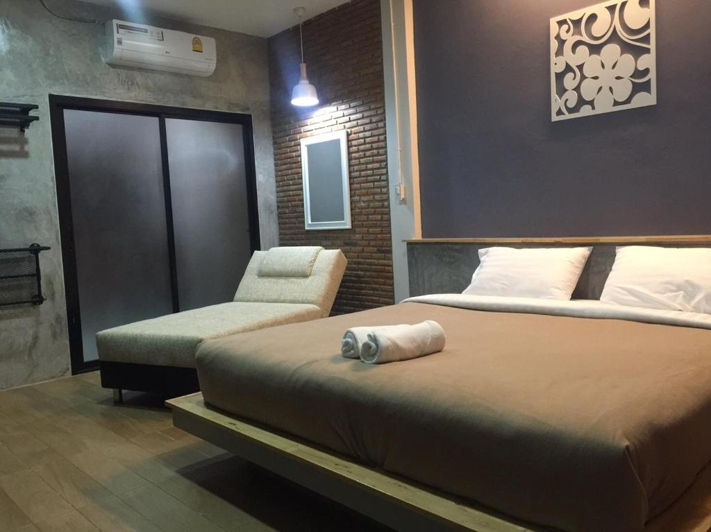 Postel nebo postele na pokoji v ubytování The C Hotel