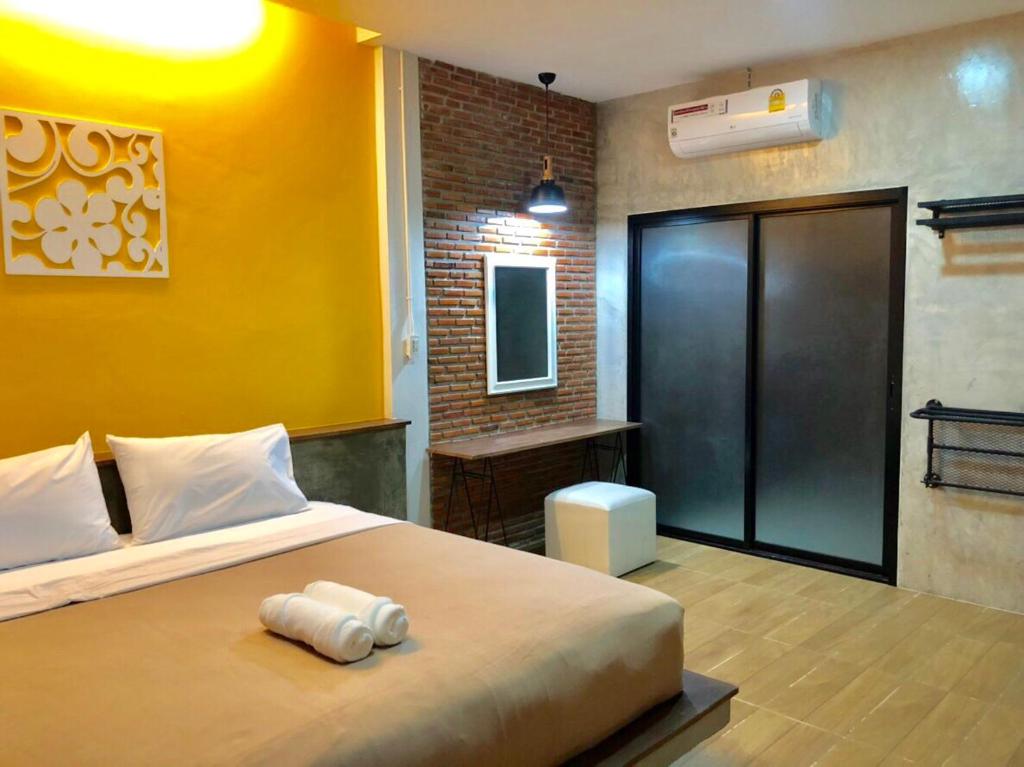 Postel nebo postele na pokoji v ubytování The C Hotel
