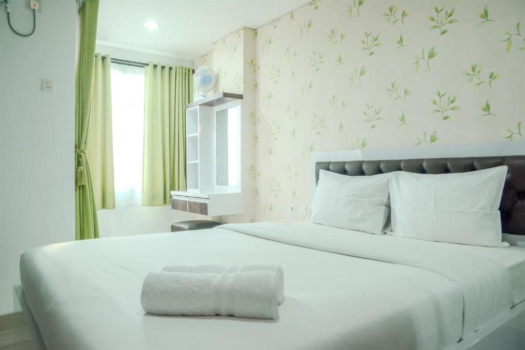 Postel nebo postele na pokoji v ubytování Fully Furnished Studio Apartment The Enviro By Travelio