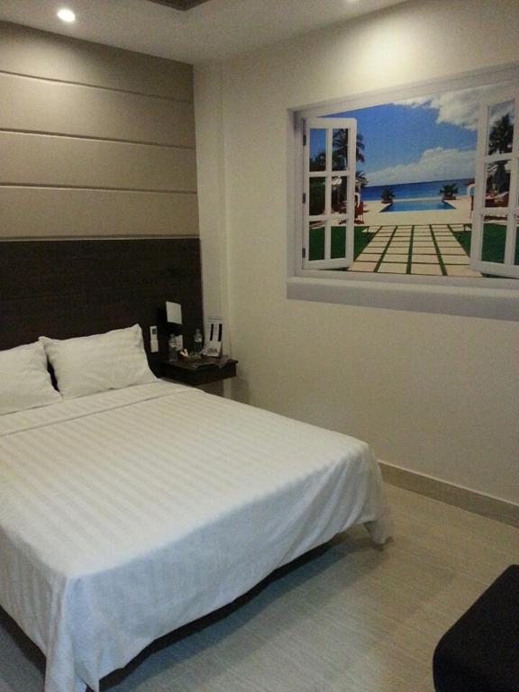 Postel nebo postele na pokoji v ubytování Duy Ninh Hotel