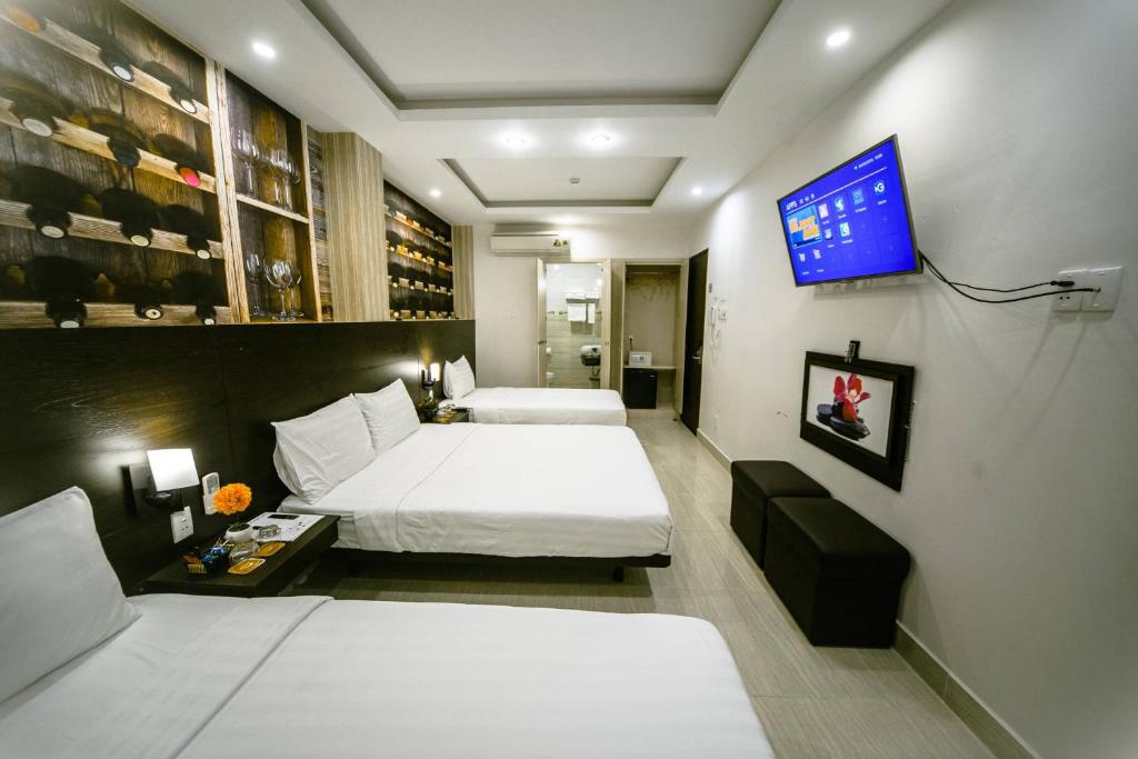 Postel nebo postele na pokoji v ubytování Duy Ninh Hotel