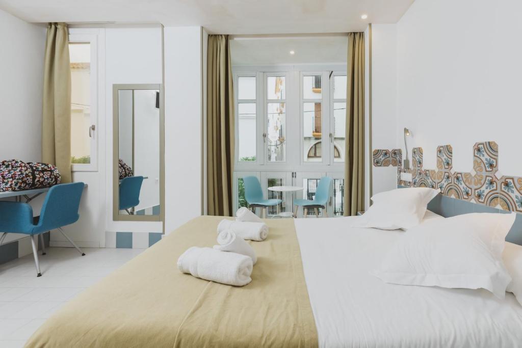 Postel nebo postele na pokoji v ubytování Hostal Gravina