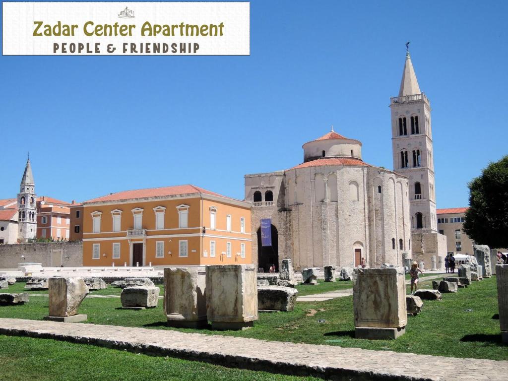 a church and a cemetery in front of a building at Zadar Center Apartment in Zadar