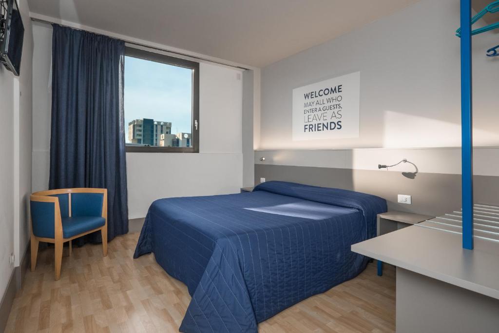 Postel nebo postele na pokoji v ubytování Hotel Martini