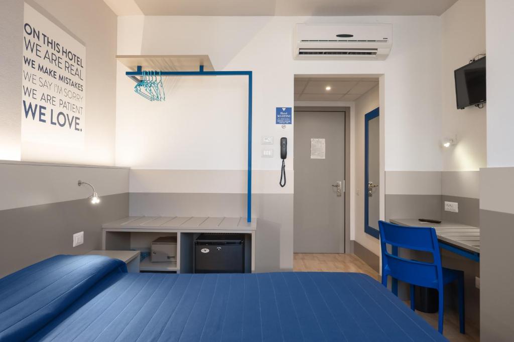 TV a/nebo společenská místnost v ubytování Hotel Martini