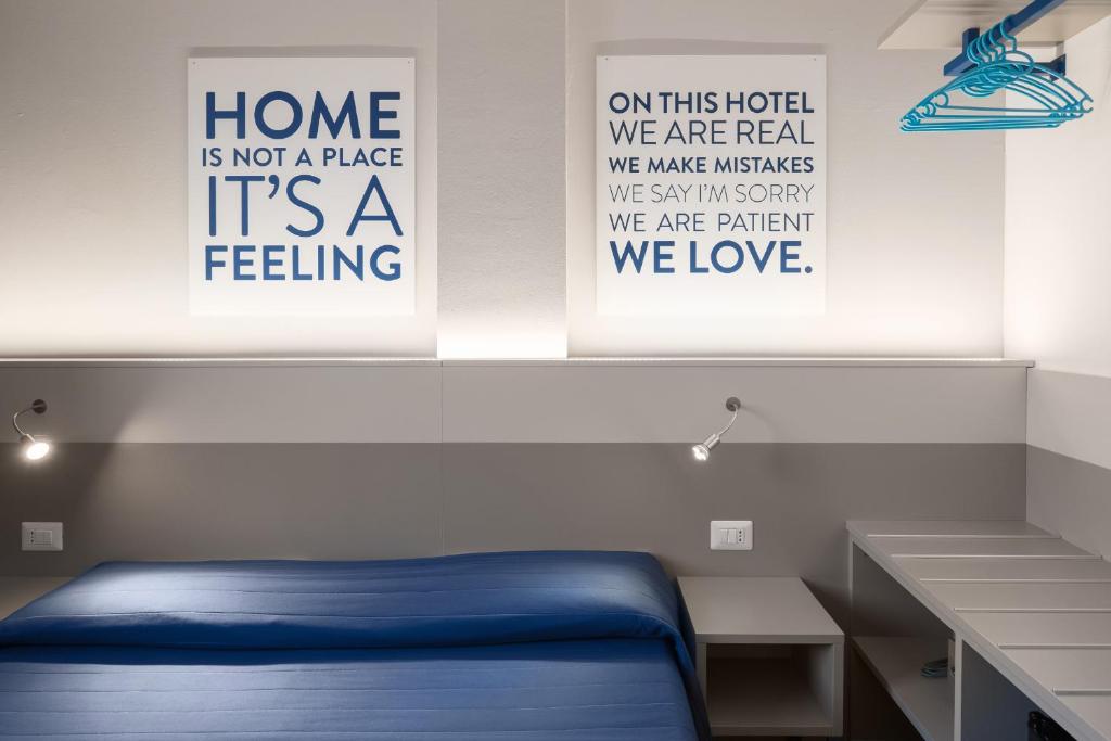 Postel nebo postele na pokoji v ubytování Hotel Martini