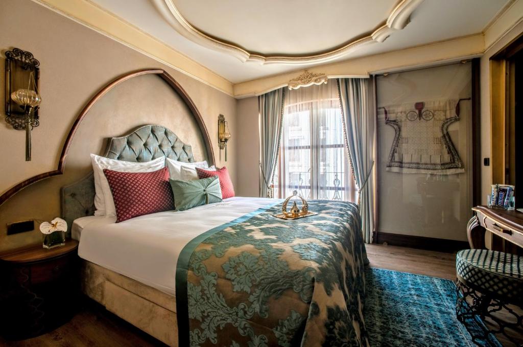 a hotel room with a large bed and a window at Romance Istanbul Hotel Boutique Class in Istanbul