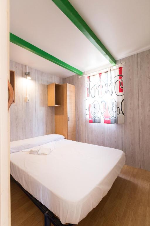 Posteľ alebo postele v izbe v ubytovaní Camping Los Llanos