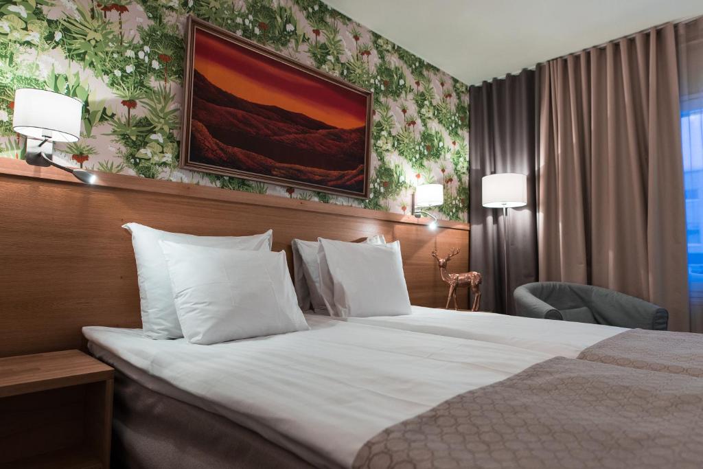 Postel nebo postele na pokoji v ubytování Hotel Aakenus