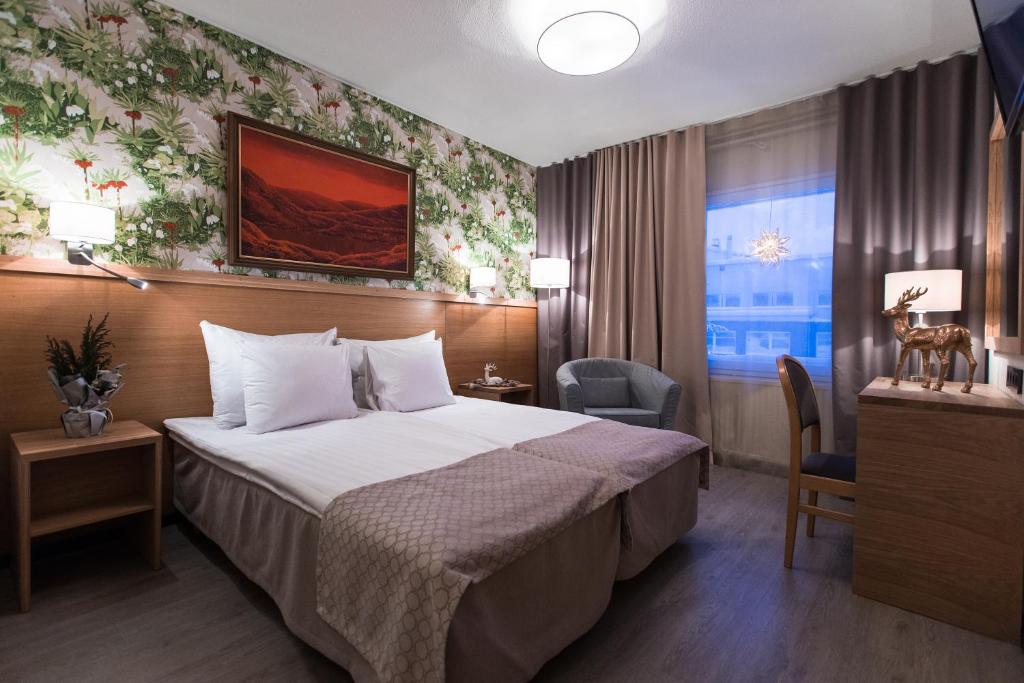 Кровать или кровати в номере Hotel Aakenus