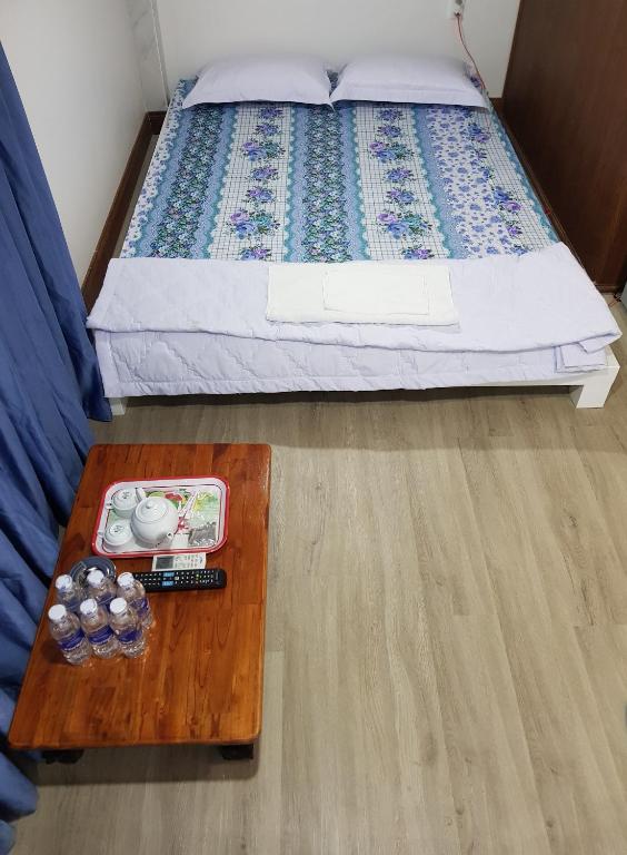 Postel nebo postele na pokoji v ubytování Minh Kim Guesthouse
