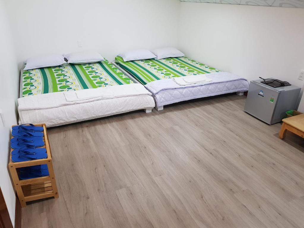 Postel nebo postele na pokoji v ubytování Minh Kim Guesthouse