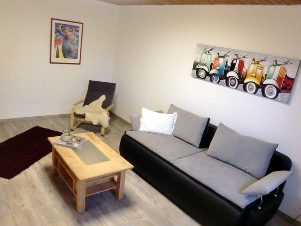 a living room with a couch and a table at Ferienwohnung Bozsik in Schweinfurt