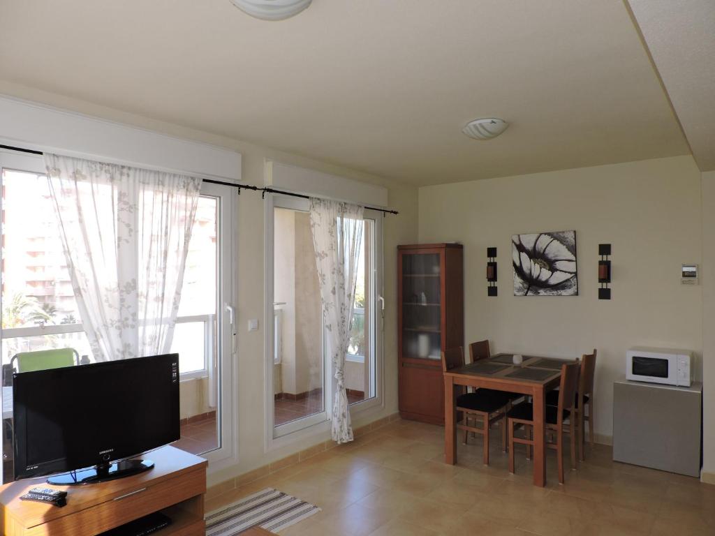 A kitchen or kitchenette at La Manga Apartments - Punta Cormoran