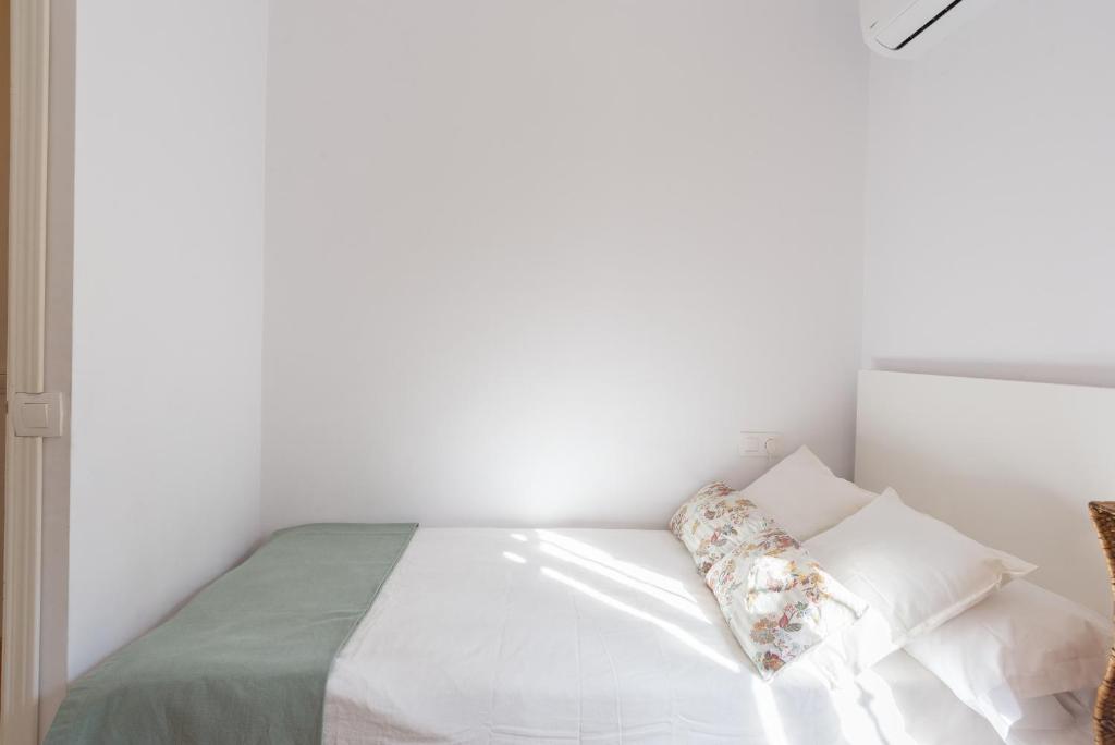 Posteľ alebo postele v izbe v ubytovaní Mundo Nuevo: Acogedor Apartamento en el Centro