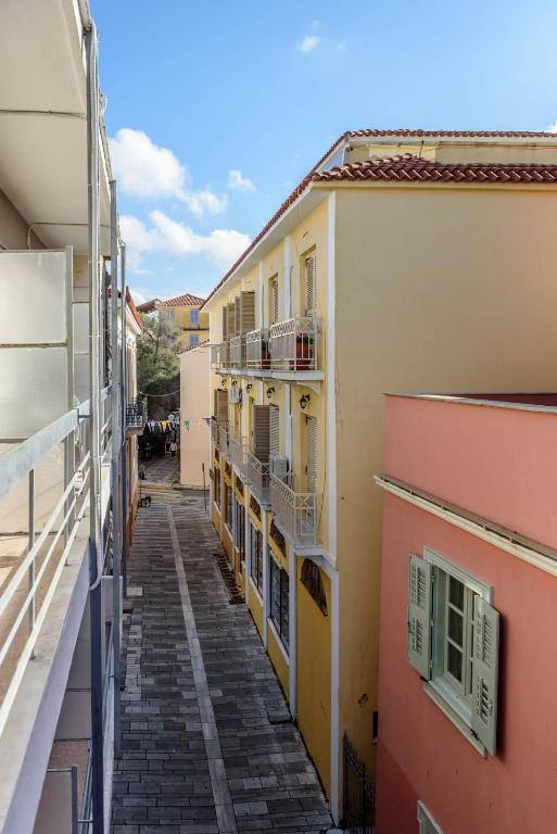 an alley between two buildings in a city at Agamemnon Hotel in Nafplio