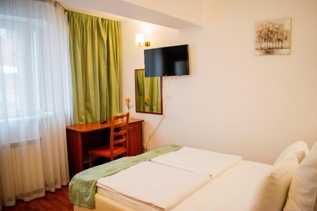 Postel nebo postele na pokoji v ubytování Atrium Hotel Bucharest City Center