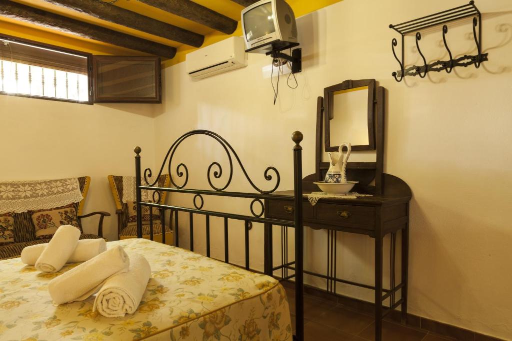 Postel nebo postele na pokoji v ubytování Cortijo La Algallumbilla
