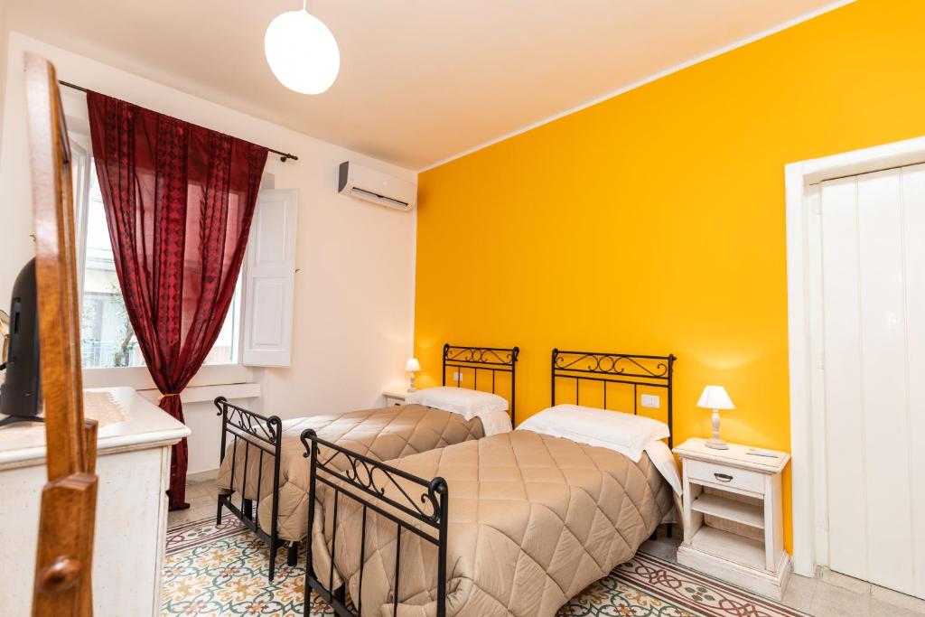 Łóżko lub łóżka w pokoju w obiekcie Casa Duconte