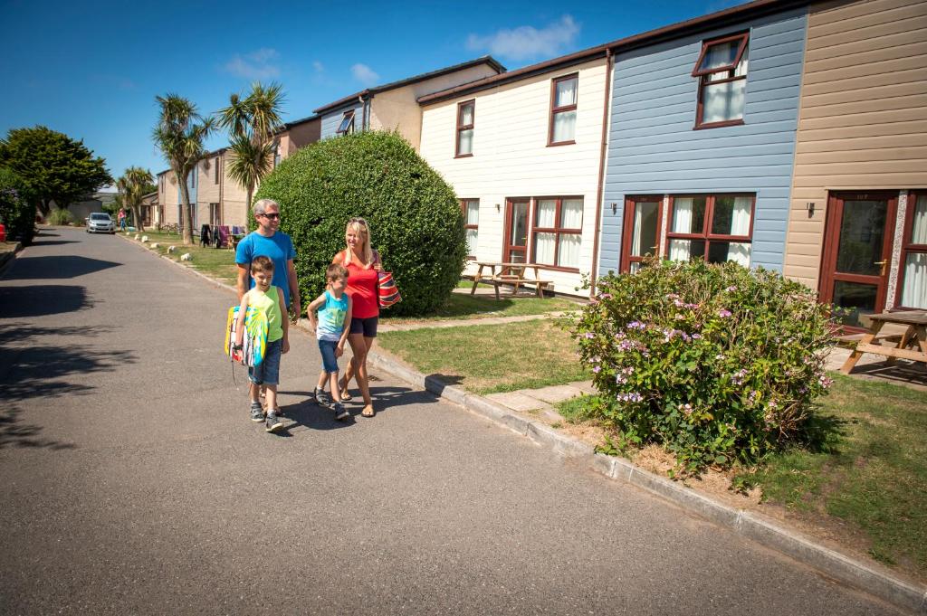 a family walking down the street at Perran View Holiday Park in St. Agnes