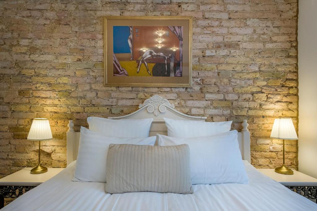 Postel nebo postele na pokoji v ubytování Kesminta Apartments