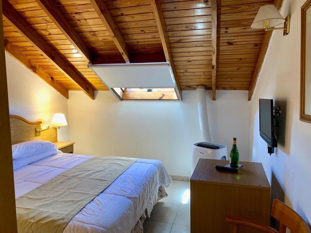 En eller flere senge i et værelse på Hotel Soleado