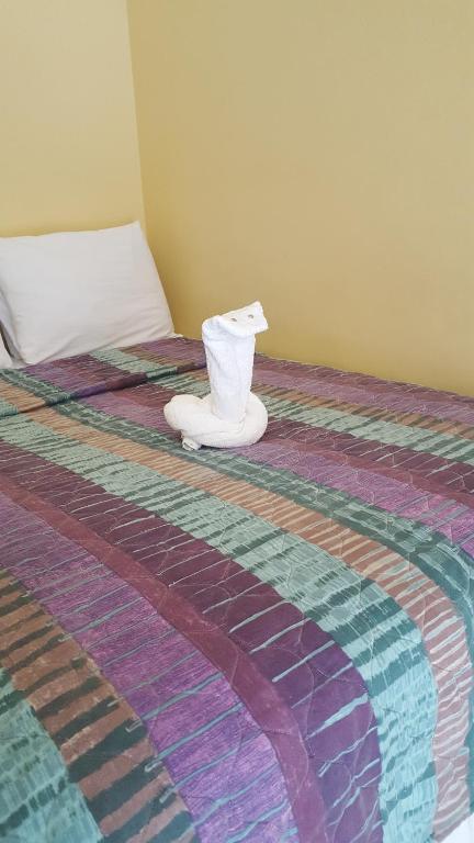 Postel nebo postele na pokoji v ubytování Aupic Paradise