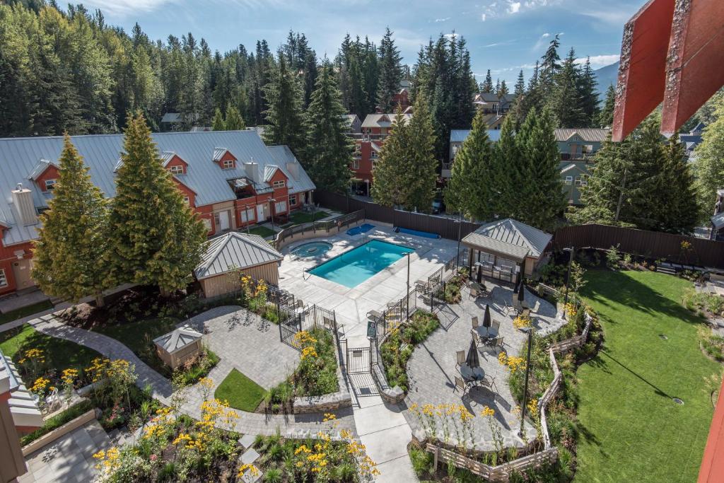 an aerial view of a house with a pool and yard at Lake Placid Lodge by Whiski Jack in Whistler