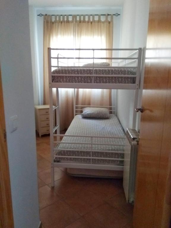 Posteľ alebo postele v izbe v ubytovaní Islantilla-Apartamento con piscina y garaje en primera línea de playa