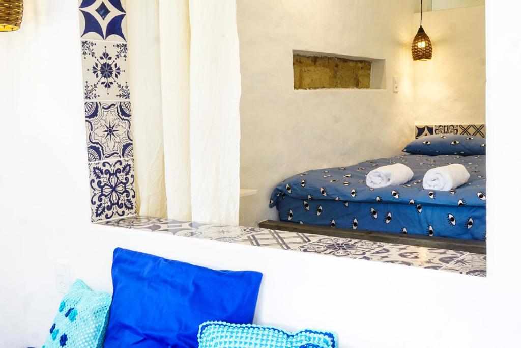 Tempat tidur dalam kamar di Terra de Aruanda pousada