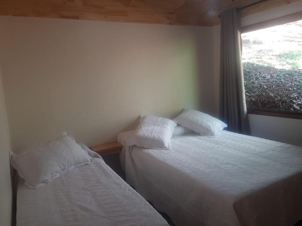 Un pat sau paturi într-o cameră la Balcón del Paraiso