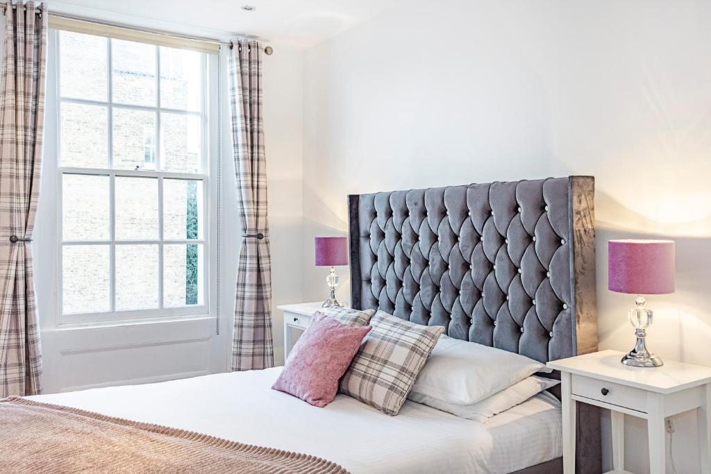 Postel nebo postele na pokoji v ubytování Knightsbridge Dream Apartment
