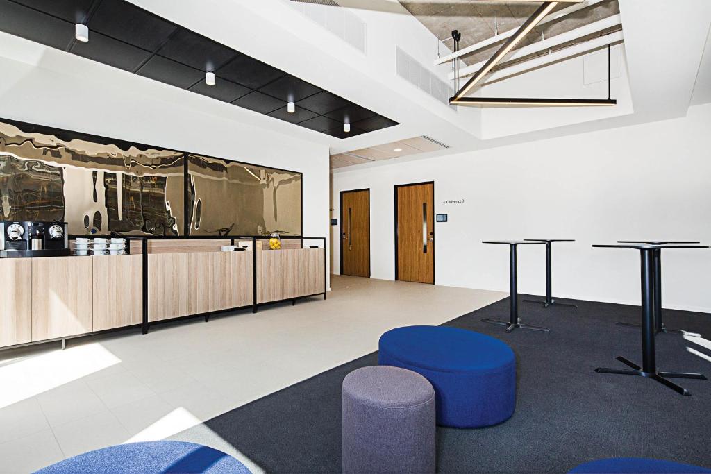 Kuchyň nebo kuchyňský kout v ubytování Mantra MacArthur Hotel