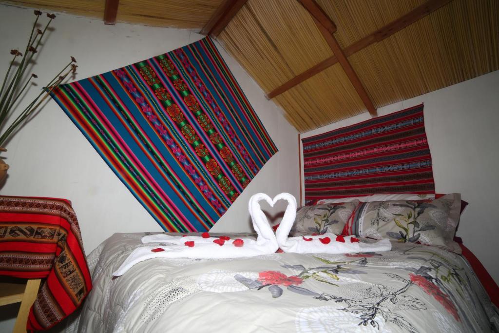 Letto o letti in una camera di Titicaca Sariri Lodge