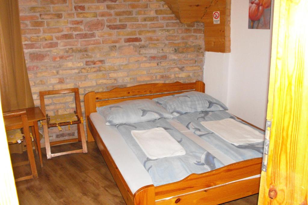 Postel nebo postele na pokoji v ubytování Hungaria Guesthouse