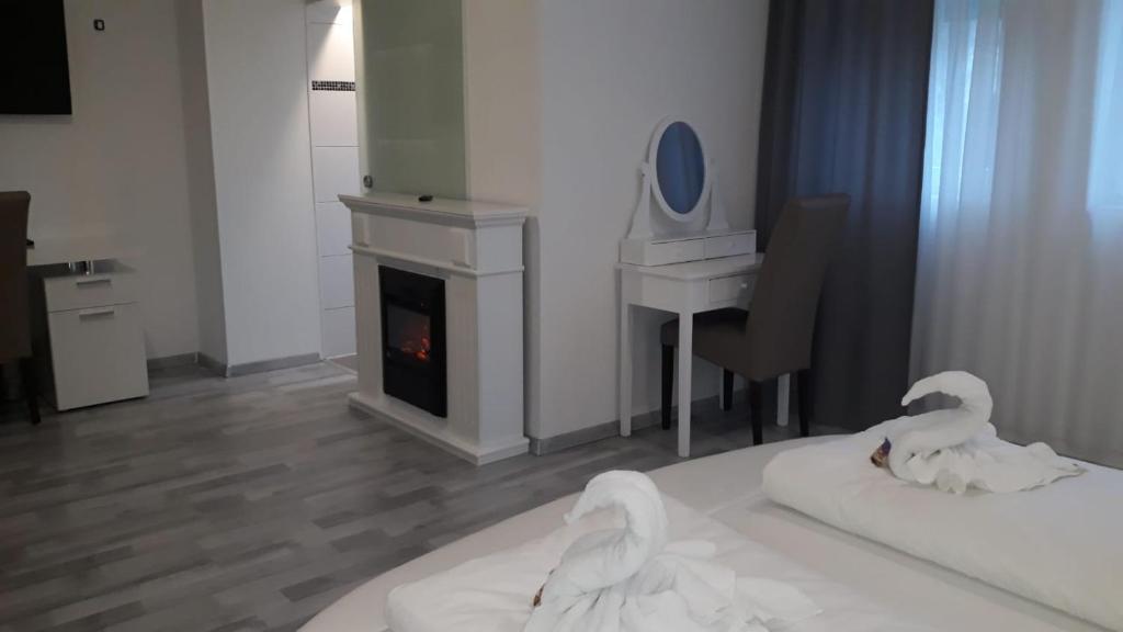 Postel nebo postele na pokoji v ubytování Das SP Hotel