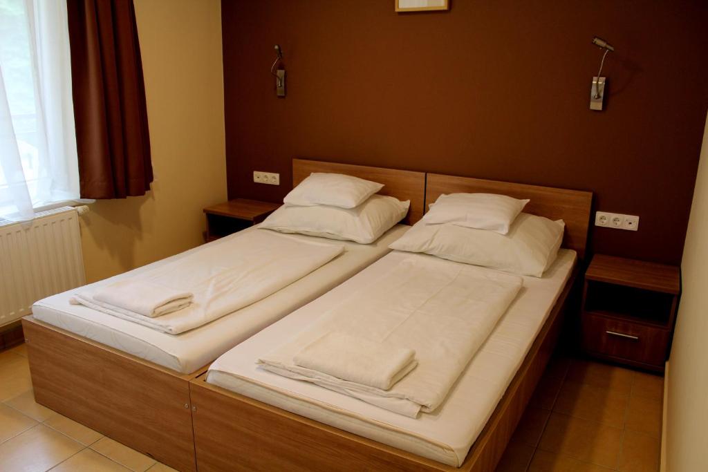 Postel nebo postele na pokoji v ubytování BF Hotel