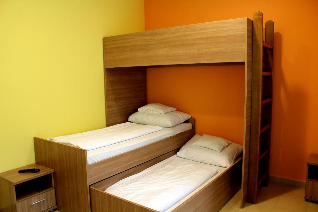 Postel nebo postele na pokoji v ubytování BF Hotel