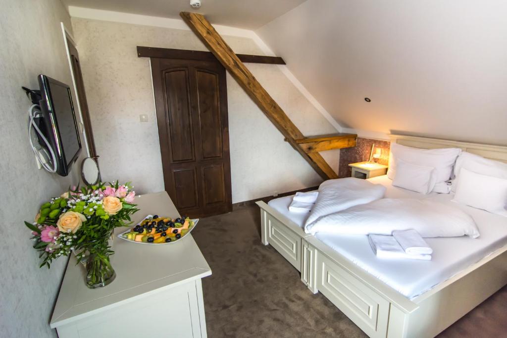 Postel nebo postele na pokoji v ubytování Boutique Hotel Annuska