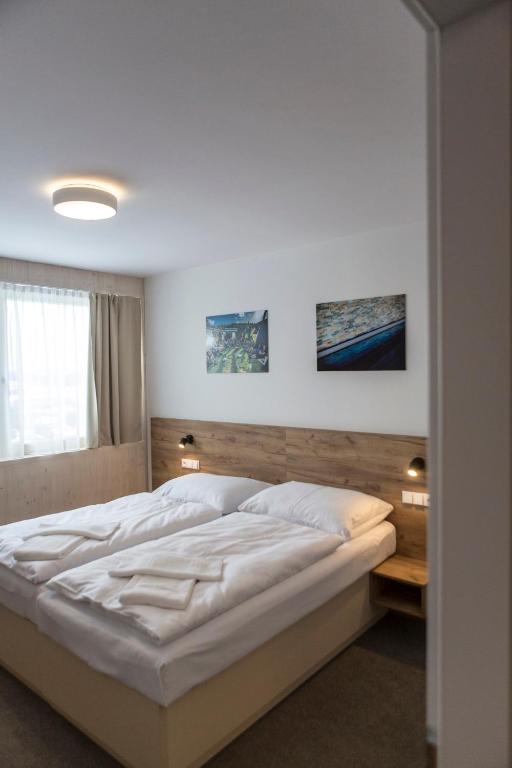 Postel nebo postele na pokoji v ubytování Hotel Monínec - Depandance Nová Javorka
