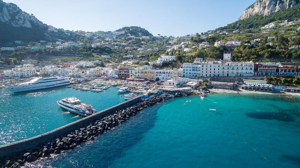 an aerial view of a harbor with boats in the water at Relais Maresca Luxury Small Hotel & Terrace Restaurant in Capri