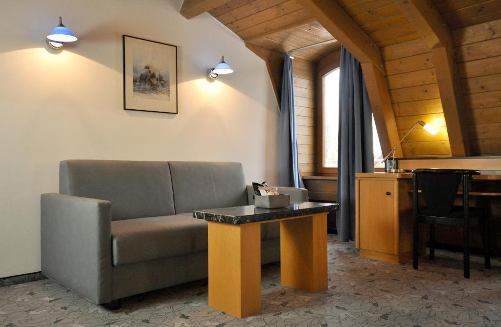 Posezení v ubytování Villa Waldperlach by Blattl