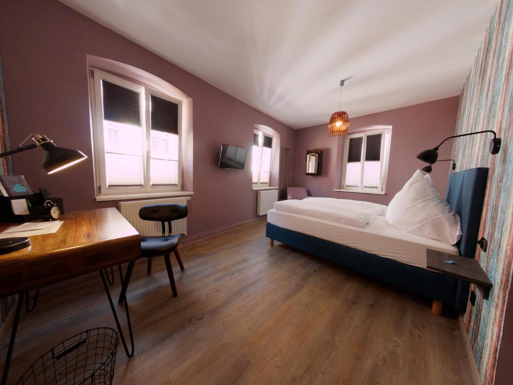 Postel nebo postele na pokoji v ubytování Hotel - Weinbar FAHR AWAY