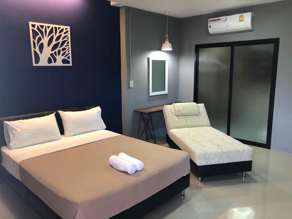 Postel nebo postele na pokoji v ubytování The C Hotel