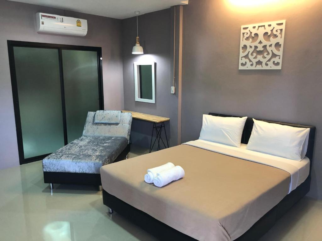 Postel nebo postele na pokoji v ubytování The C Hotel