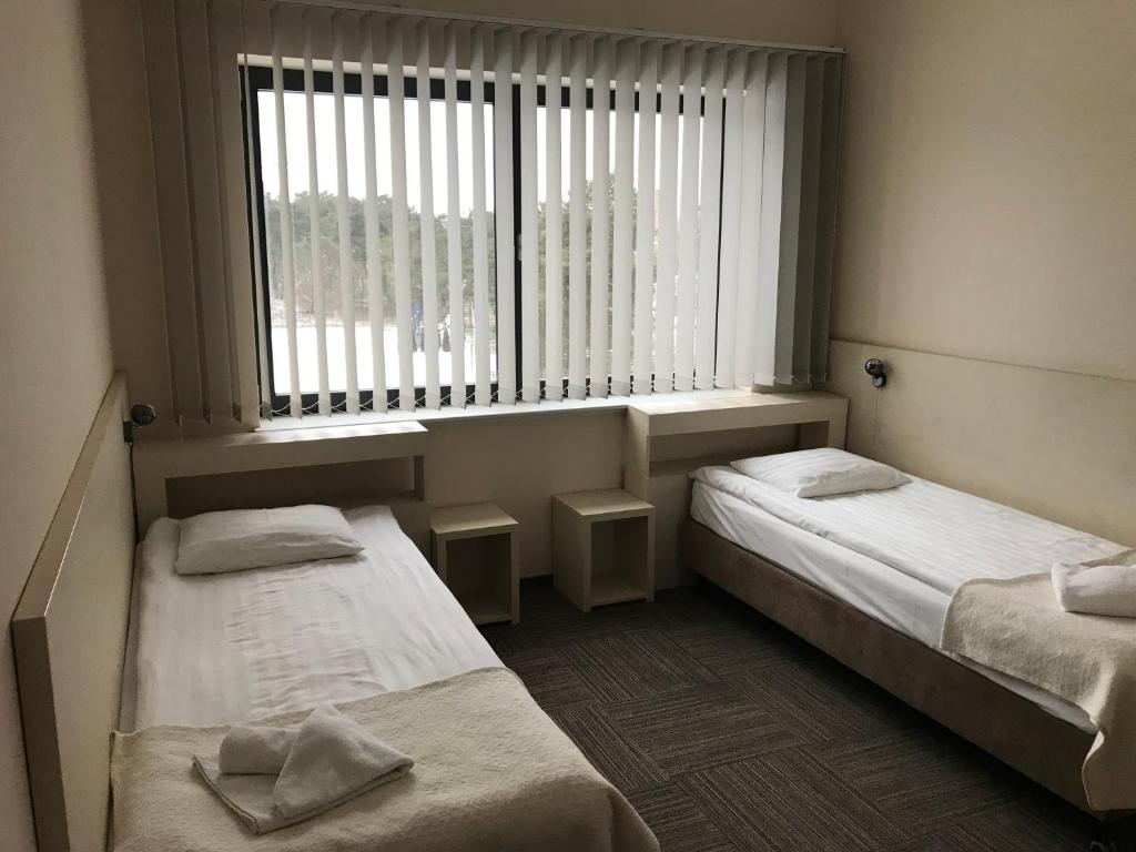 Posteľ alebo postele v izbe v ubytovaní Hotel Meeting
