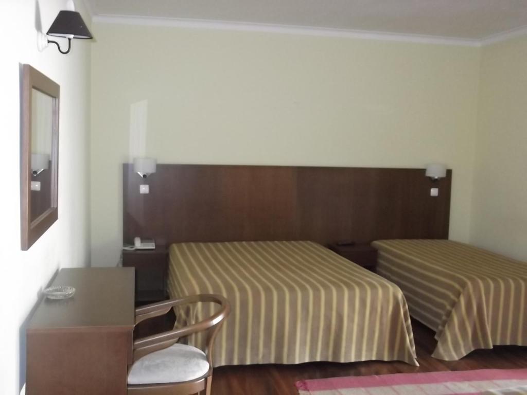 Postel nebo postele na pokoji v ubytování Hotel Minho Belo