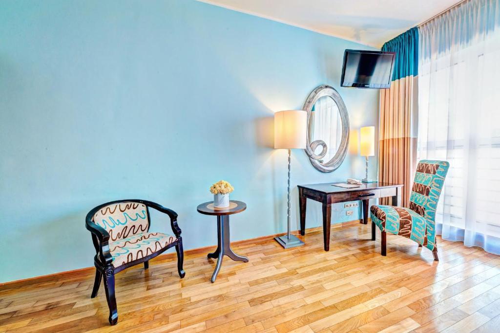 Ein Sitzbereich in der Unterkunft Don Prestige Residence