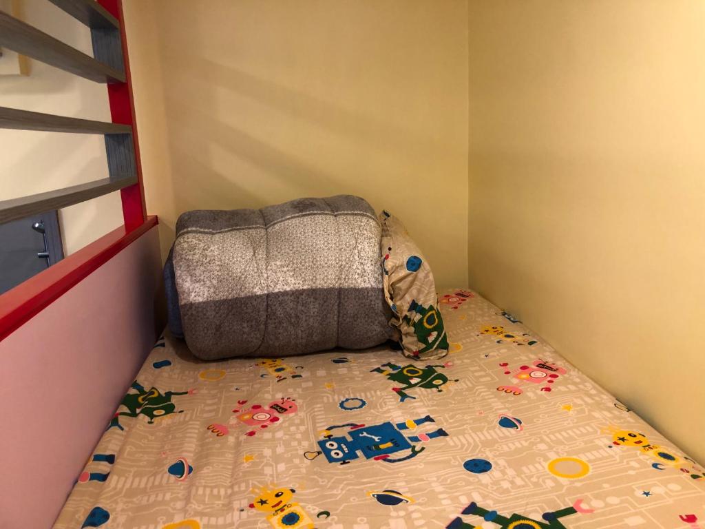 Postel nebo postele na pokoji v ubytování Kai Cheng Inn 旅館134