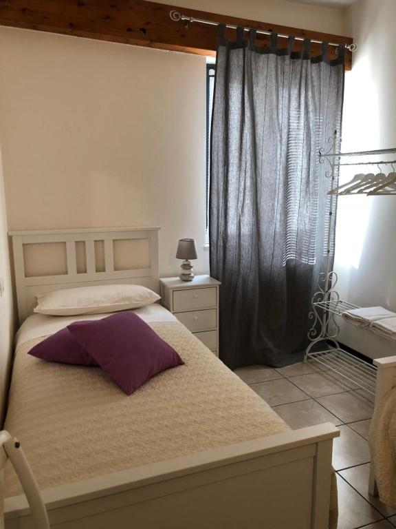 Posteľ alebo postele v izbe v ubytovaní Appartamento Rosegarden